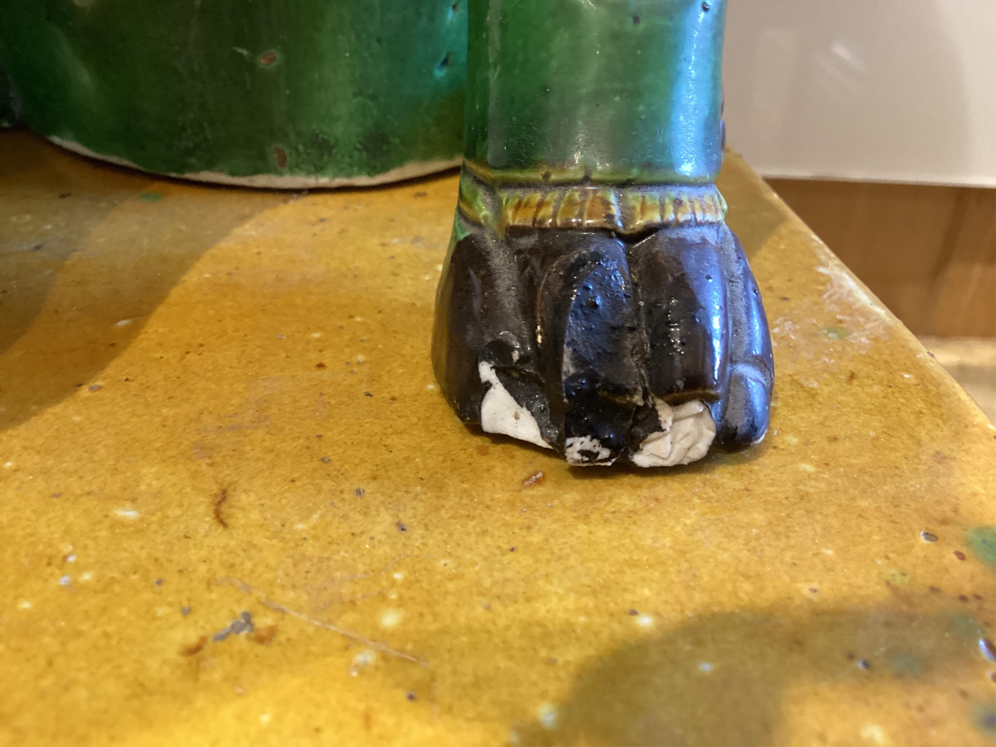 A pair of large Chinese sancai-glazed biscuit figures of Buddhist temple lions, 19th century